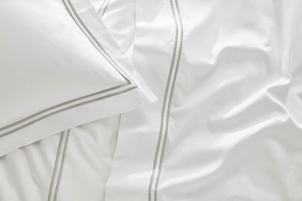 Close-up image of the fitted sheet from our organic cotton bedding collection