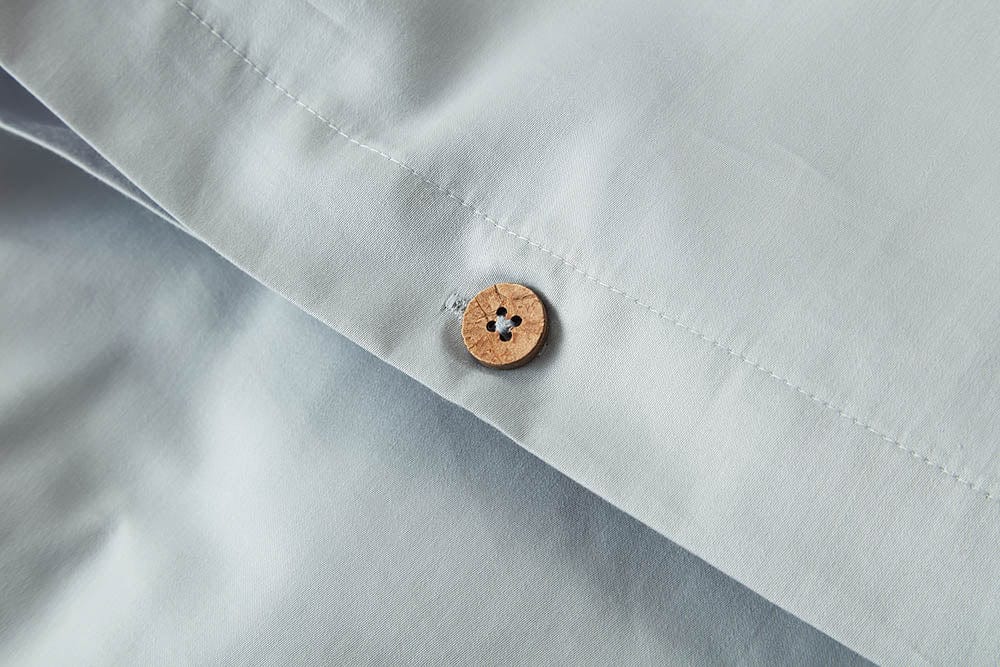 Snug and breathable organic cotton fitted sheet, providing a comfortable foundation for a restful sleep.