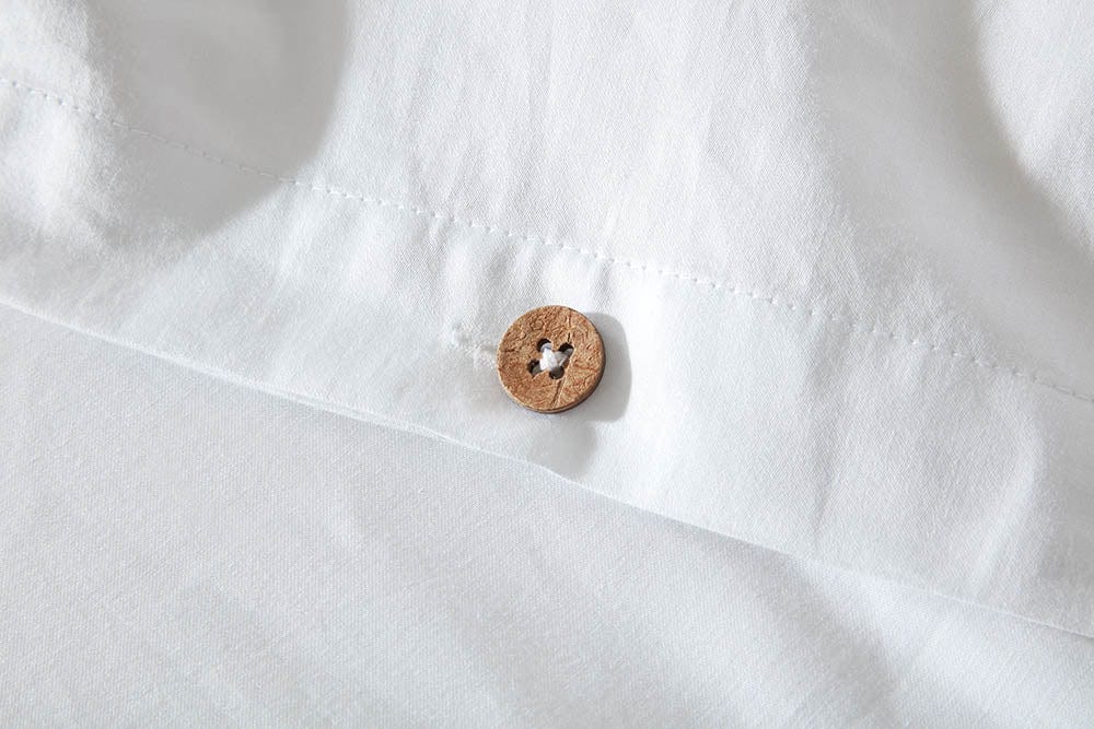 Snug and breathable organic cotton fitted sheet, providing a comfortable foundation for a restful sleep.