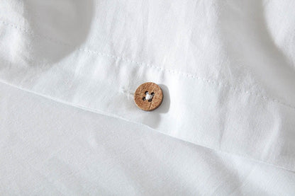Snug and breathable organic cotton fitted sheet, providing a comfortable foundation for a restful sleep.