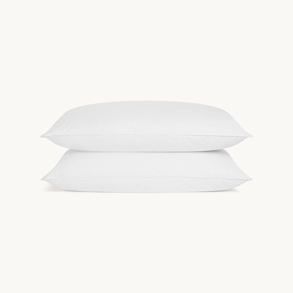 Ultimate comfort and elegance in the two-pillow set, embracing luxurious feather support.